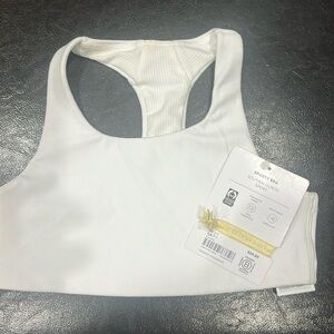 Girls size S/7 sporty bra. Lulu lemon NWT color is white. Athleta girl